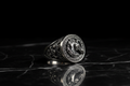 Unicorn ring on black marble
