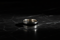 Eclipse ring on black marble